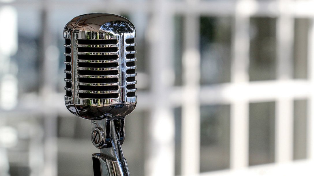 A vintage microphone made of metal.
